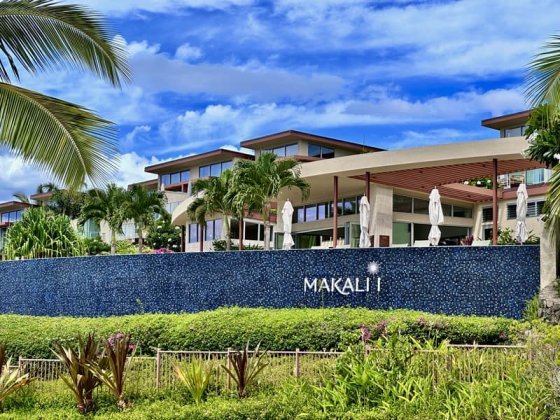 Outside Blue Tile Of Makalii At Wailea Pool With Buildings In Background