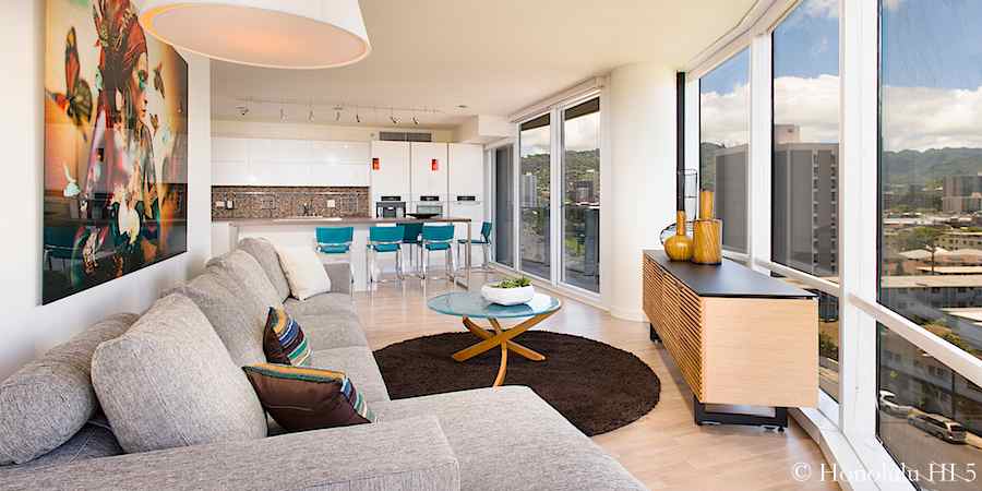 Living room in #903 with floor to ceiling glass windows.