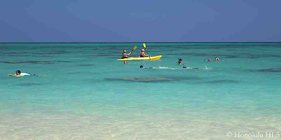 Kayakers and snorkelers alike enjoying Lanikai's ocean