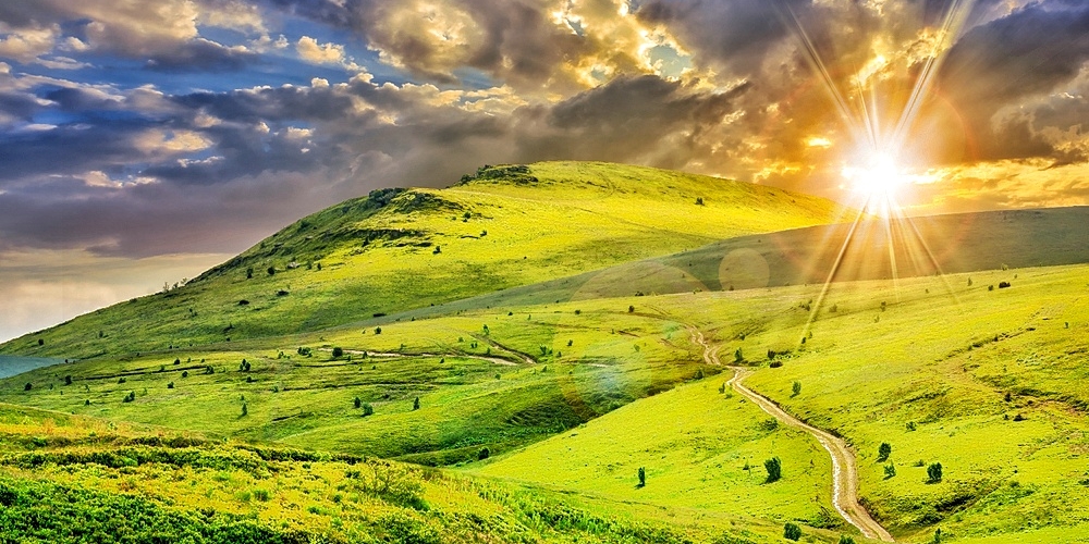 Mountain path against sunset